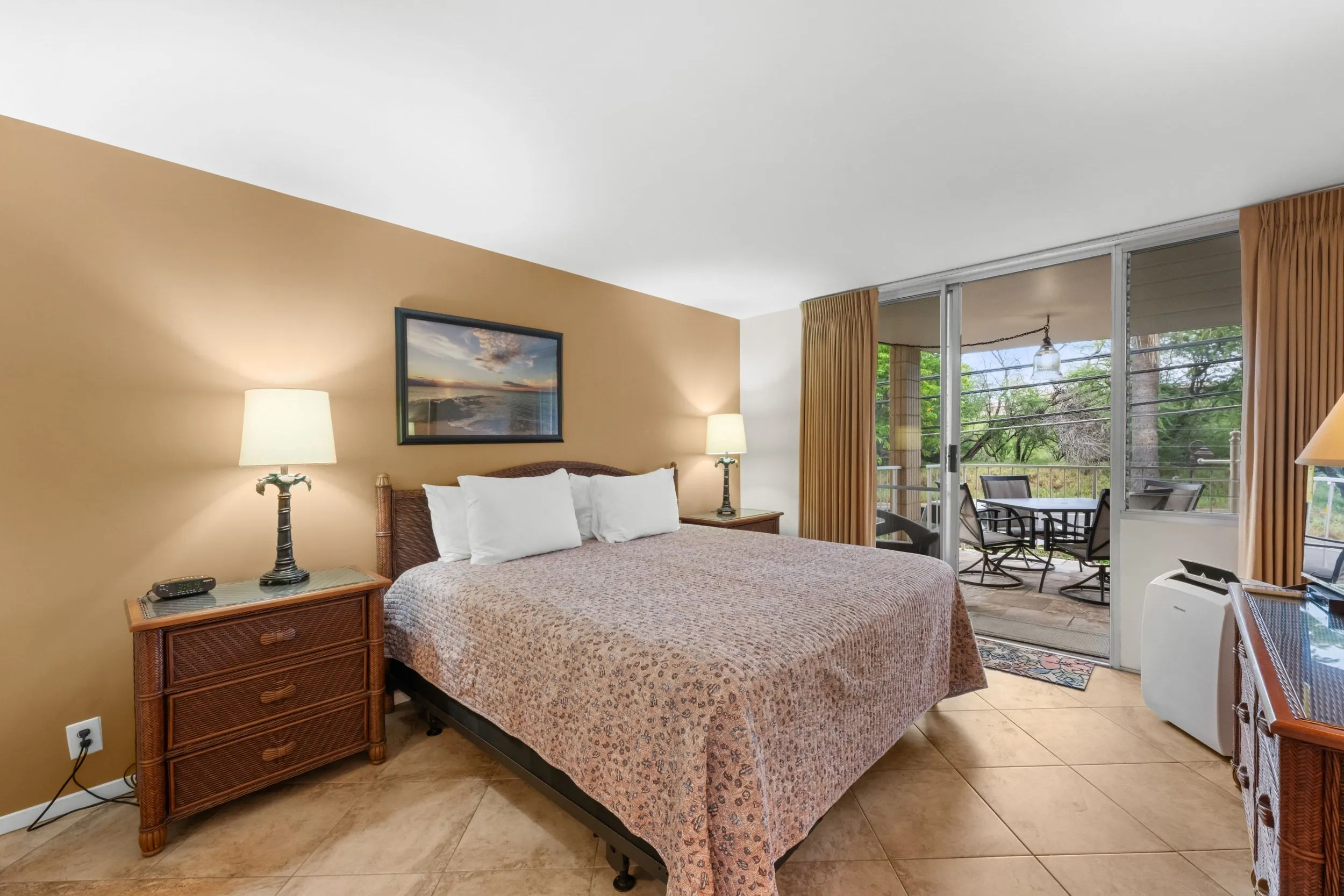 Bedroom with a king bed and a sliding door to the lanai