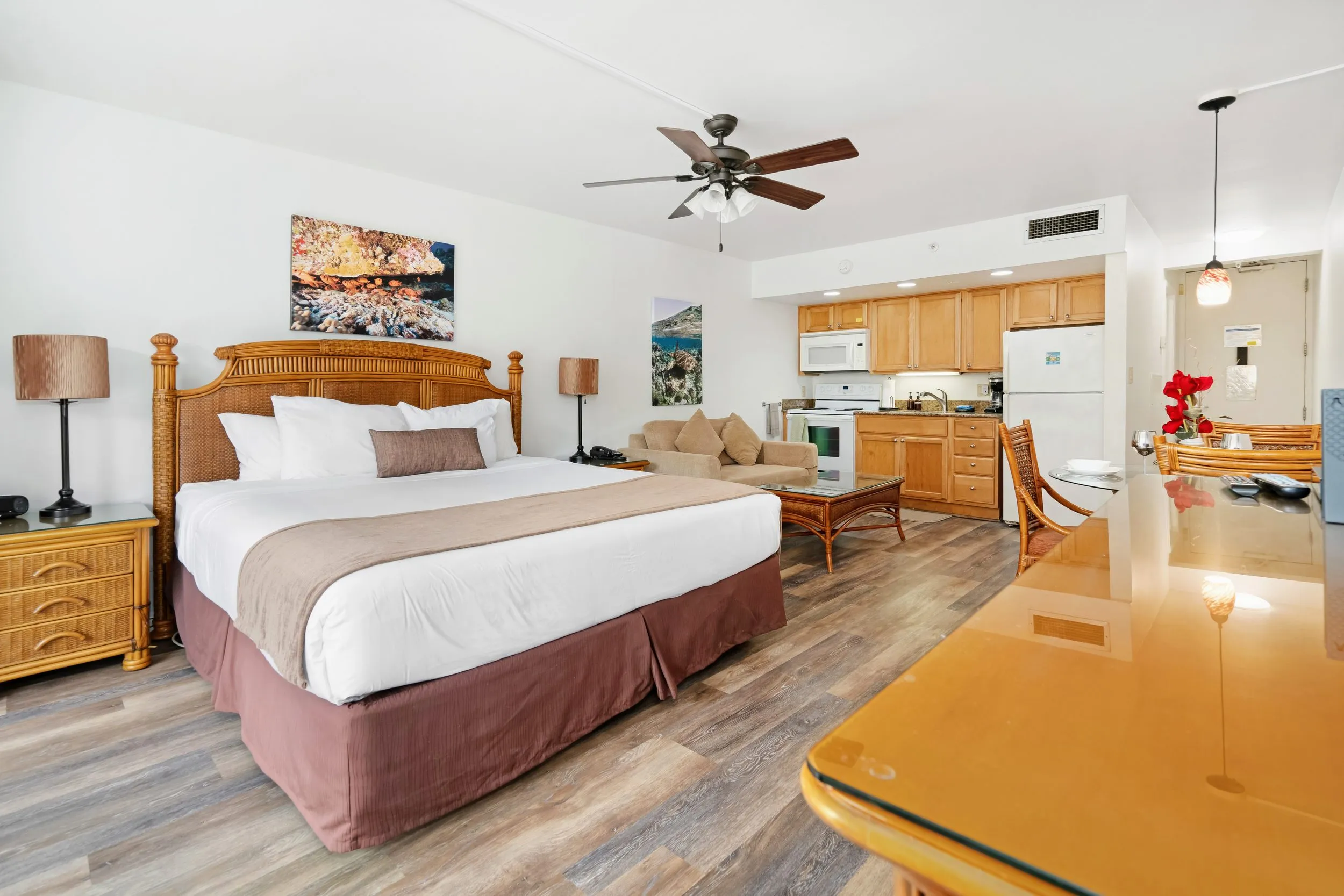 King bed in the studio with the kitchenette beyond